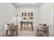 Home office featuring decor, plush seating, modern lighting, and light hardwood floors at 8332 Sea Glass Ct, Sarasota, FL 34240