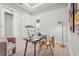 Bright home office featuring decor, plush seating, modern lighting, and light hardwood floors at 8332 Sea Glass Ct, Sarasota, FL 34240