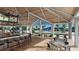 Outdoor bar area with seating, a TV, and views of the pool, offering a relaxing entertainment space at 8332 Sea Glass Ct, Sarasota, FL 34240