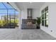 Outdoor kitchen with stainless steel appliances and large window at 8332 Sea Glass Ct, Sarasota, FL 34240