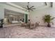 Spacious covered lanai with comfortable seating area overlooking a lush lawn and offering seamless indoor-outdoor living at 8332 Sea Glass Ct, Sarasota, FL 34240