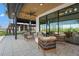 Outdoor seating area with modern furniture, tile floor, and views of the community at 8332 Sea Glass Ct, Sarasota, FL 34240
