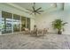 Outdoor patio with ceiling fan, comfortable seating, and sliding glass doors with a great view at 8332 Sea Glass Ct, Sarasota, FL 34240