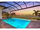 Resort-style pool with lake view and sunset at 8332 Sea Glass Ct, Sarasota, FL 34240