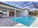 Screened pool and spa features modern design, spacious patio, and bright natural light at 8332 Sea Glass Ct, Sarasota, FL 34240