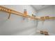 Spacious walk-in closet featuring custom wood shelving and ample storage space at 8332 Sea Glass Ct, Sarasota, FL 34240