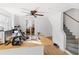 Modern kitchen features an island and appliances, open to adjacent bedroom and staircase at 1501 14Th W Ave, Bradenton, FL 34205