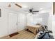 Simple bedroom with wood floors and ceiling fan at 1501 14Th W Ave, Bradenton, FL 34205