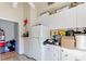 Kitchen features white cabinets and appliances at 1501 14Th W Ave, Bradenton, FL 34205