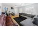 Living area with gray sectional and brown couch at 1501 14Th W Ave, Bradenton, FL 34205