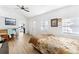 Cozy bedroom with wood floors and access to kitchen at 1501 14Th W Ave, Bradenton, FL 34205