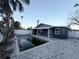 Home with a large, inground pool in the backyard at 15416 2Nd E St, Madeira Beach, FL 33708