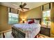 Comfortable bedroom with a queen-size bed and ceiling fan at 2029 Calusa Lakes Blvd, Nokomis, FL 34275