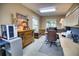 Bright home office featuring wood furniture and a large window at 2029 Calusa Lakes Blvd, Nokomis, FL 34275