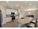 Island kitchen with granite countertops and stainless steel appliances at 2532 Avolet Ct, Lakewood Ranch, FL 34211