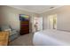 Bedroom with a dresser, chair, and view of the bathroom at 2532 Avolet Ct, Lakewood Ranch, FL 34211