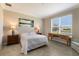 Bright bedroom with wood desk and water view at 2532 Avolet Ct, Lakewood Ranch, FL 34211