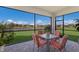 Screened porch with lake view and patio furniture at 2532 Avolet Ct, Lakewood Ranch, FL 34211