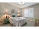 Bedroom with a queen-size bed and window at 2532 Avolet Ct, Lakewood Ranch, FL 34211