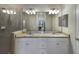 Double sink bathroom with granite countertop and large mirror at 2532 Avolet Ct, Lakewood Ranch, FL 34211
