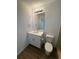 Clean bathroom with white vanity, toilet, and wood-look flooring at 2533 6Th Ave Drive E # 2, Bradenton, FL 34208