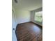 Spacious bedroom with large window and wood-look floors at 2533 6Th Ave Drive E # 2, Bradenton, FL 34208