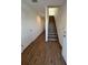 Bright entryway with wood-look floors and staircase leading to the second floor at 2533 6Th Ave Drive E # 2, Bradenton, FL 34208