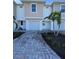 Two-story townhome with attached garage and paved driveway at 2533 6Th Ave Drive E # 2, Bradenton, FL 34208