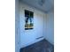 White front door entry with sidelights and brick walkway at 2533 6Th Ave Drive E # 2, Bradenton, FL 34208