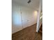 Hallway with wood-look floors and access to bedrooms at 2533 6Th Ave Drive E # 2, Bradenton, FL 34208