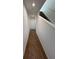 Upstairs hallway with wood-look flooring and staircase at 2533 6Th Ave Drive E # 2, Bradenton, FL 34208