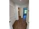 Bright hallway with wood-look flooring, leading to bedrooms and bathroom at 2533 6Th Ave Drive E # 2, Bradenton, FL 34208