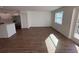 Spacious living room featuring wood-look floors and access to a balcony at 2533 6Th Ave Drive E # 2, Bradenton, FL 34208