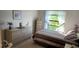 Cozy bedroom with a double bed, dresser, and large window at 2808 60Th W Ave # 626, Bradenton, FL 34207