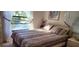Bright bedroom with a double bed and pond view at 2808 60Th W Ave # 626, Bradenton, FL 34207