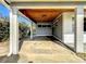 Covered carport with concrete flooring at 2877 Michigan St, Sarasota, FL 34237