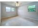 Well-lit bedroom featuring a ceiling fan at 2877 Michigan St, Sarasota, FL 34237
