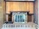 Brick fireplace with a modern metal screen at 2877 Michigan St, Sarasota, FL 34237
