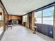 Spacious living room featuring a fireplace and large windows at 2877 Michigan St, Sarasota, FL 34237