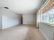 Living room with large window and view to backyard at 2877 Michigan St, Sarasota, FL 34237