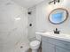 Modern bathroom with marble shower and gray vanity at 2877 Michigan St, Sarasota, FL 34237