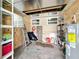 Unfinished basement area with shelving and storage at 2877 Michigan St, Sarasota, FL 34237