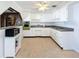 Kitchen features white cabinets, green oven and gray countertops at 2877 Michigan St, Sarasota, FL 34237