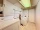 Laundry room with washer, dryer, and storage at 2877 Michigan St, Sarasota, FL 34237