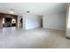 Open living area with terrazzo floor and view into adjacent room at 2877 Michigan St, Sarasota, FL 34237