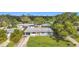 House in a residential neighborhood with a well-maintained lawn and driveway at 2877 Michigan St, Sarasota, FL 34237