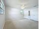 Spacious bedroom with ceiling fan and double closet at 2877 Michigan St, Sarasota, FL 34237
