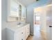 Clean bathroom featuring a white vanity and mirrored cabinet at 2877 Michigan St, Sarasota, FL 34237