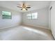 Bright bedroom with ceiling fan and window at 2877 Michigan St, Sarasota, FL 34237