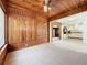 Bright dining area with wood paneling and view into kitchen at 2877 Michigan St, Sarasota, FL 34237